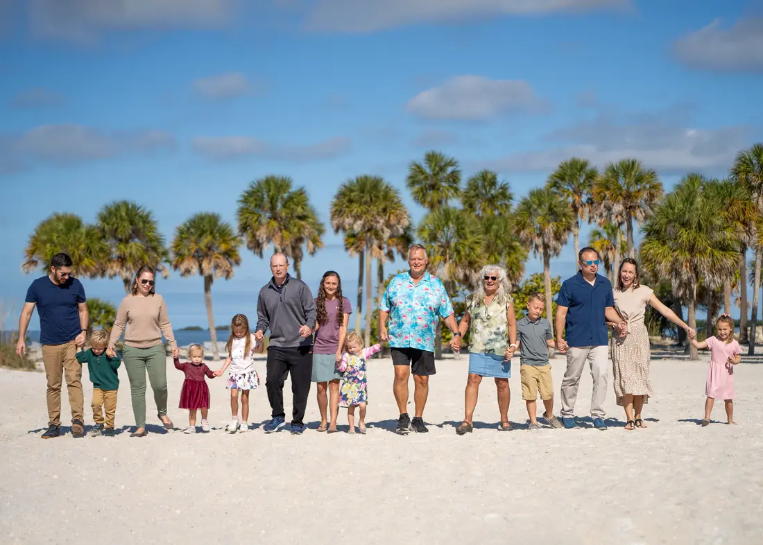 Family walking together on the shoreline