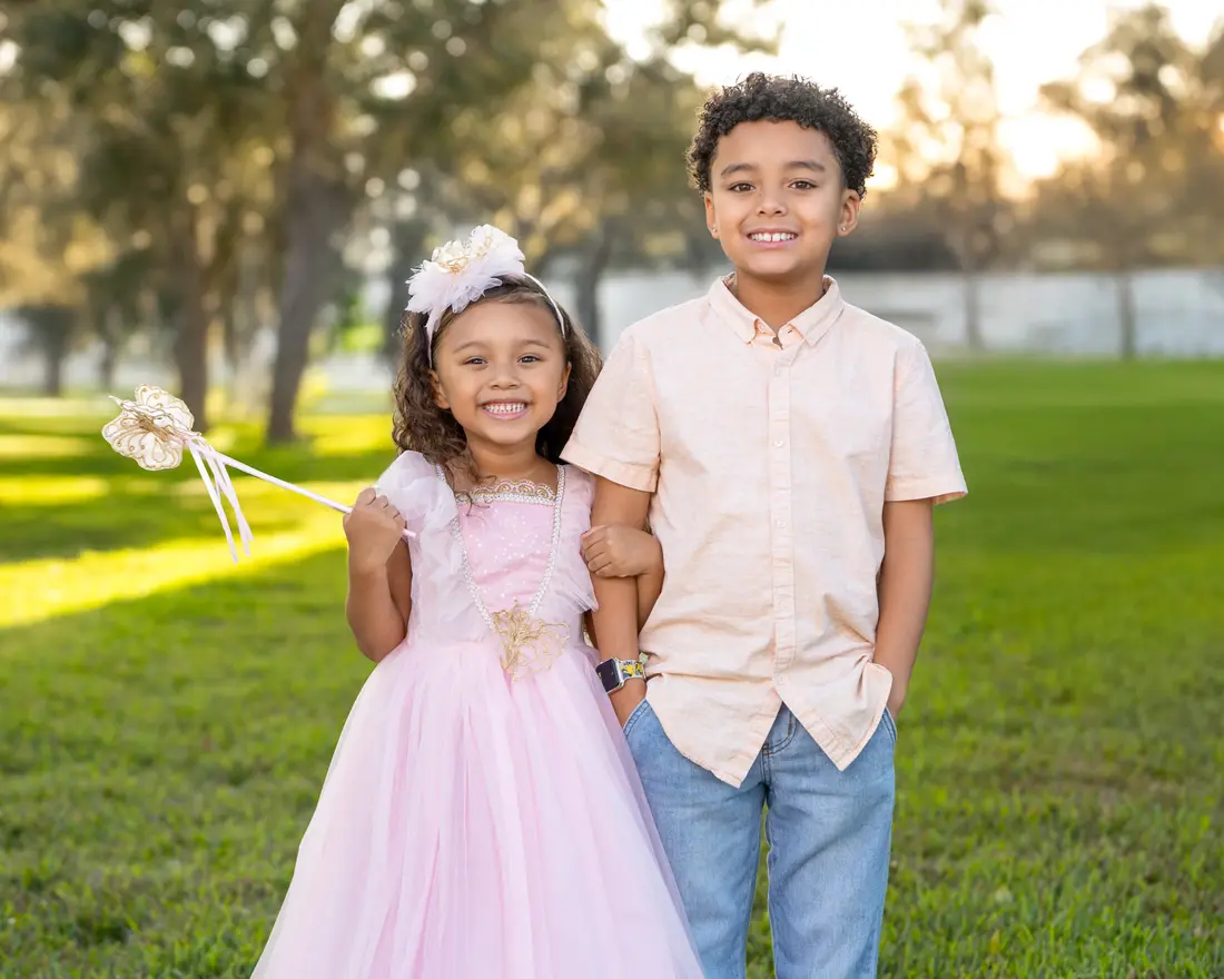 Brother and sister portrait at golden hour