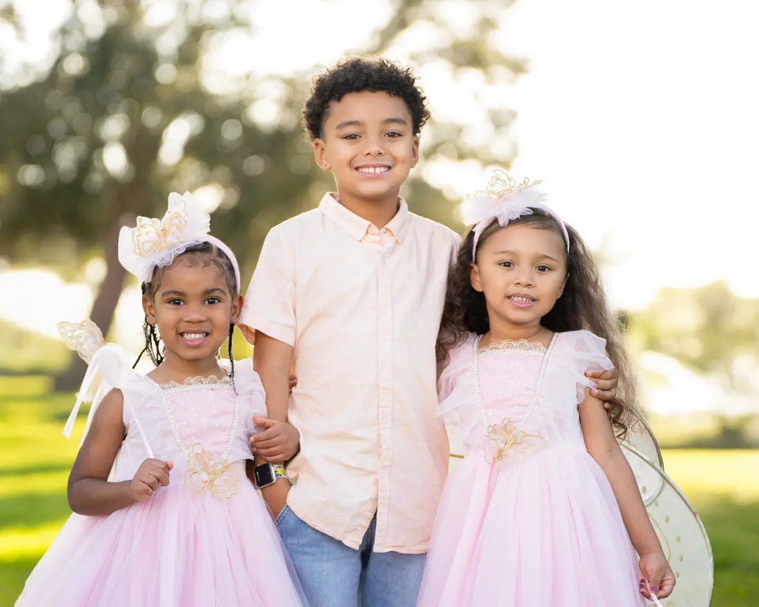 Siblings at golden hour, family photographer Tampa