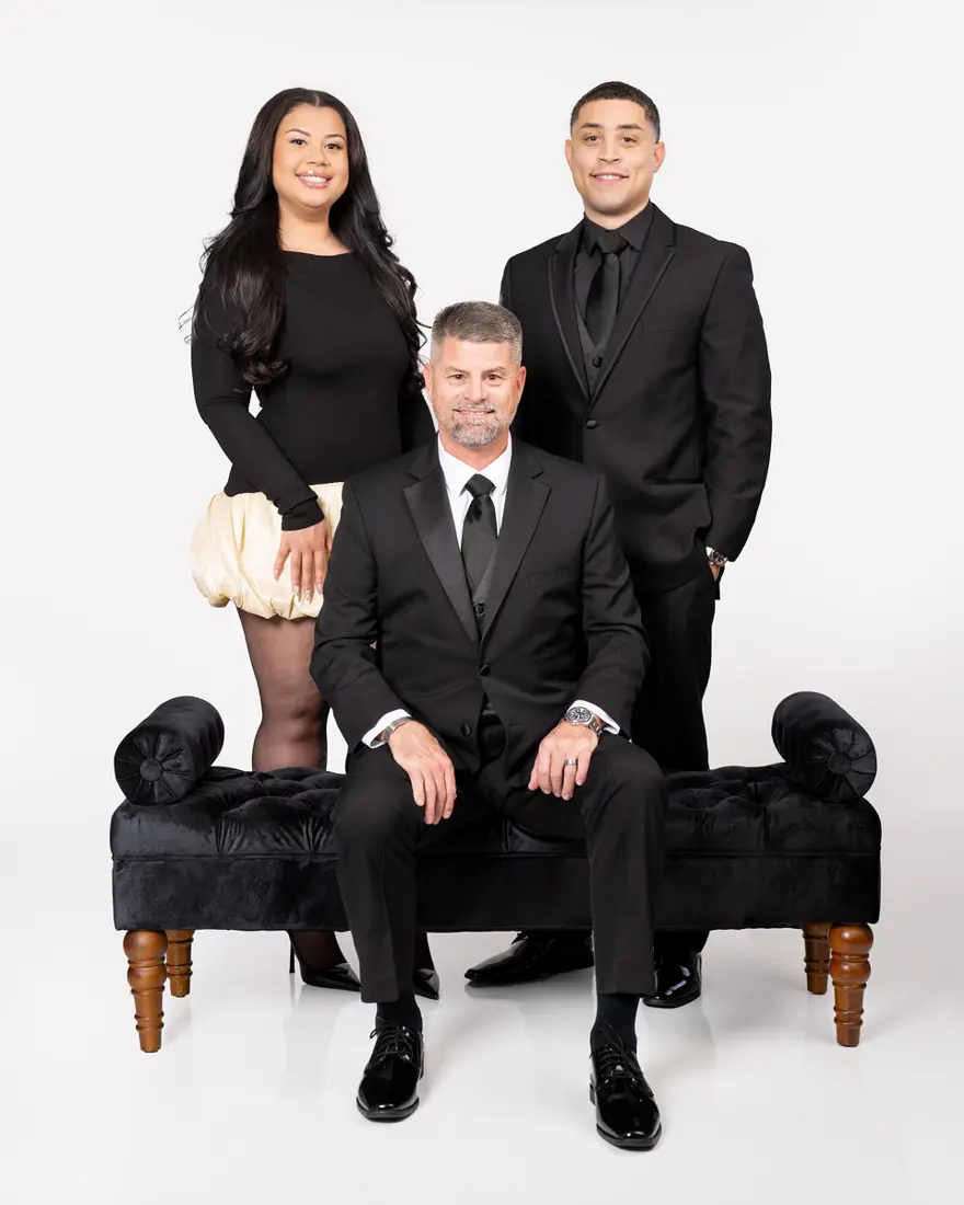 Family studio portrait in black and white outfits